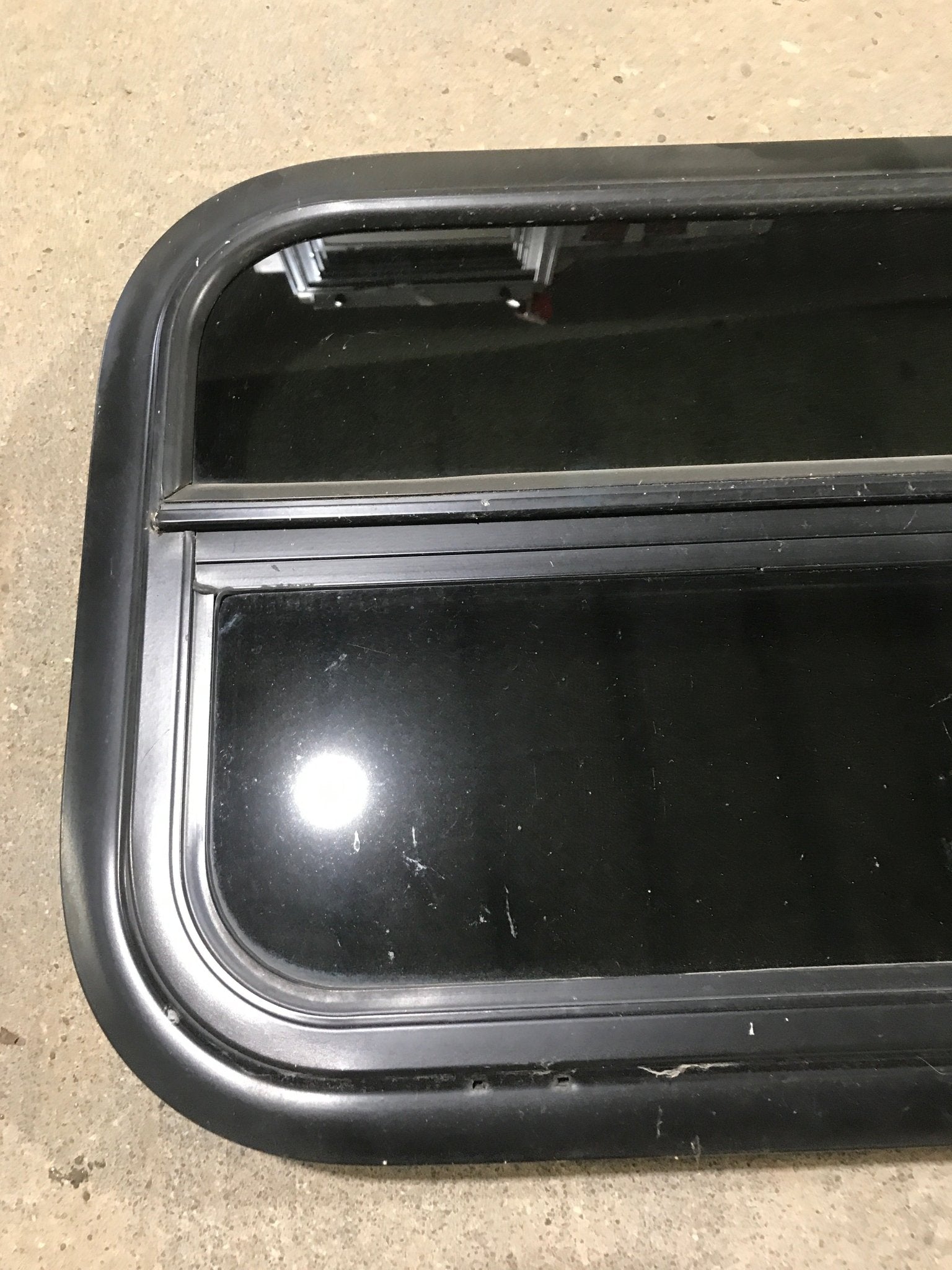 Used Black Radius Opening Window : 23 1/2" W x 14 1/2" H x 1 7/8" - Young Farts RV Parts
