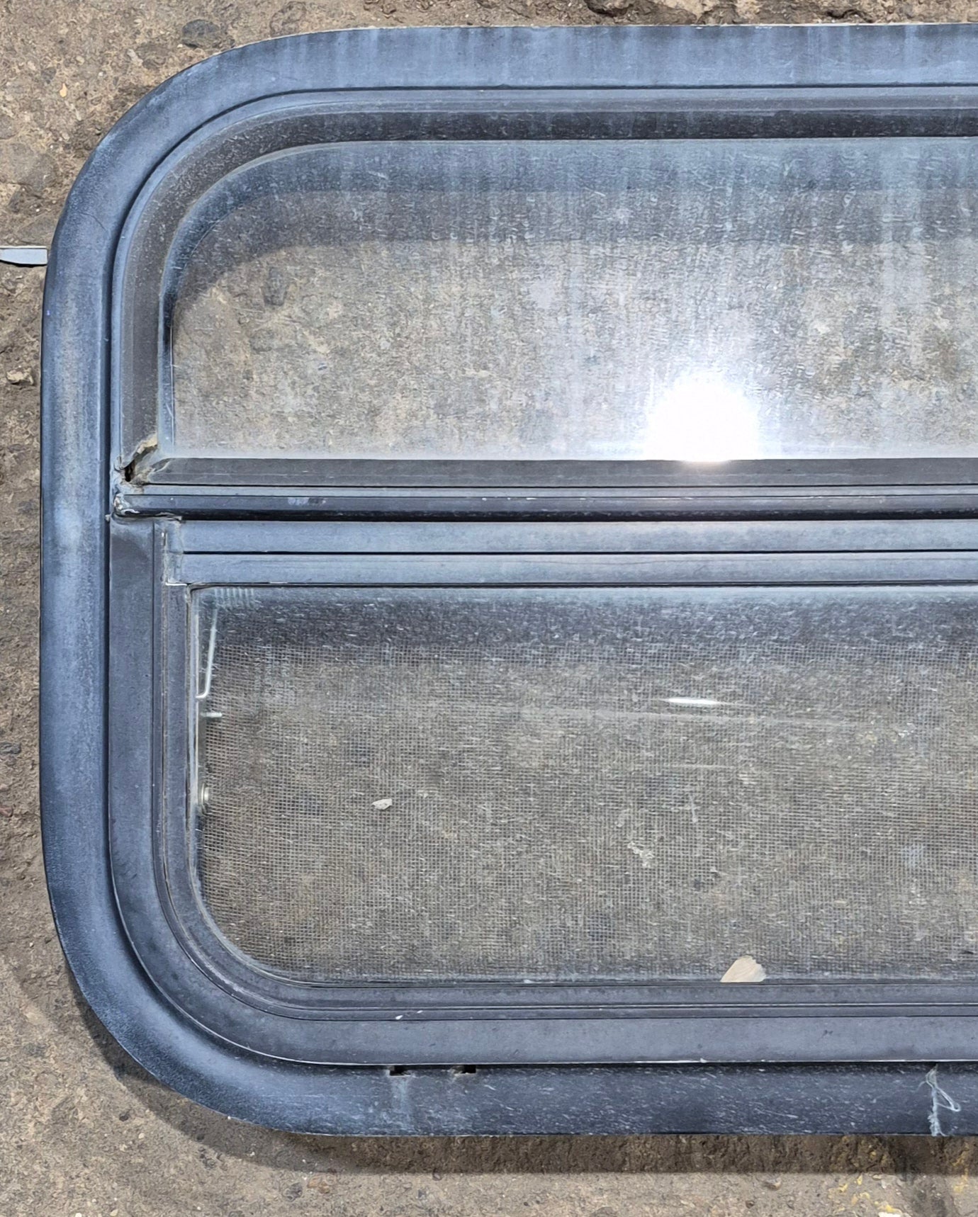 Used Black Radius Opening Window : 23 1/2" W x 14 1/4" H x 1 7/8" - Young Farts RV Parts