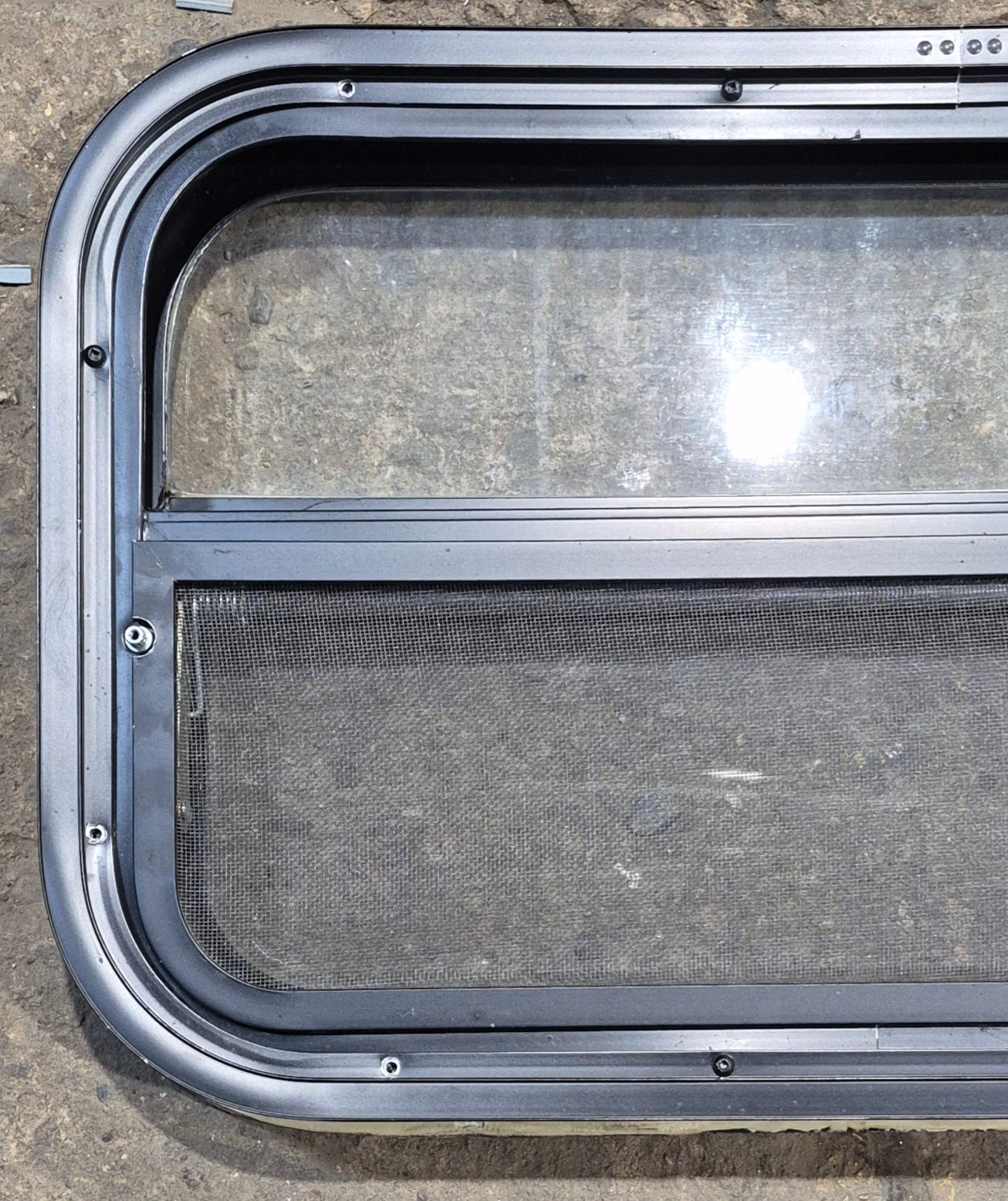 Used Black Radius Opening Window : 23 1/2" W x 14 1/4" H x 1 7/8" - Young Farts RV Parts