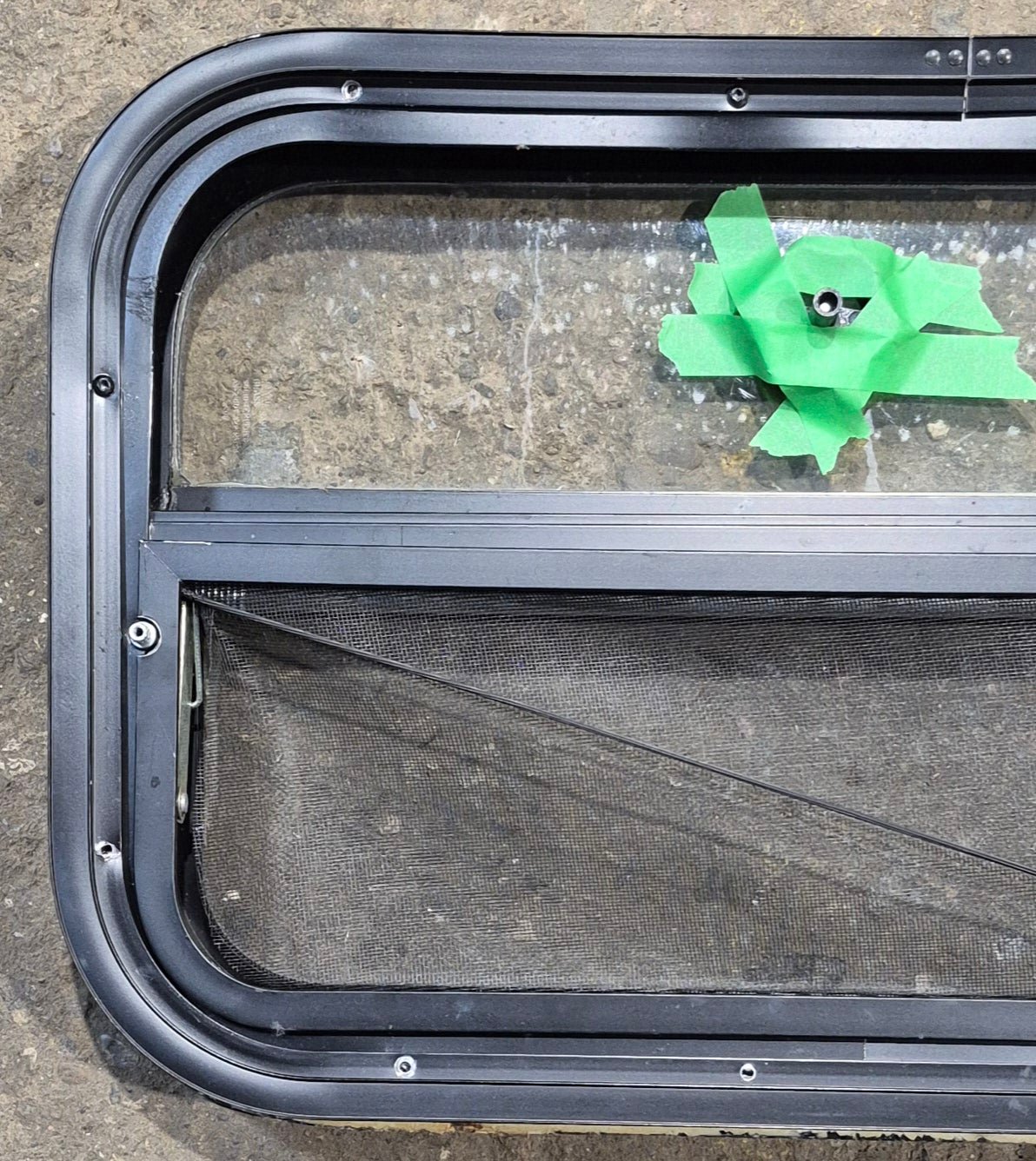 Used Black Radius Opening Window : 23 1/2" W x 14 1/4" H x 1 7/8" - Young Farts RV Parts