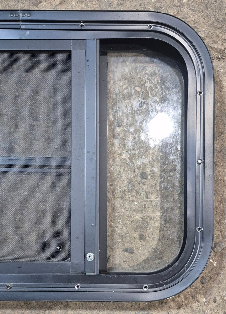 Used Black Radius Opening Window : 23 1/2" W x 15 1/2" H x 1 7/8" - Young Farts RV Parts