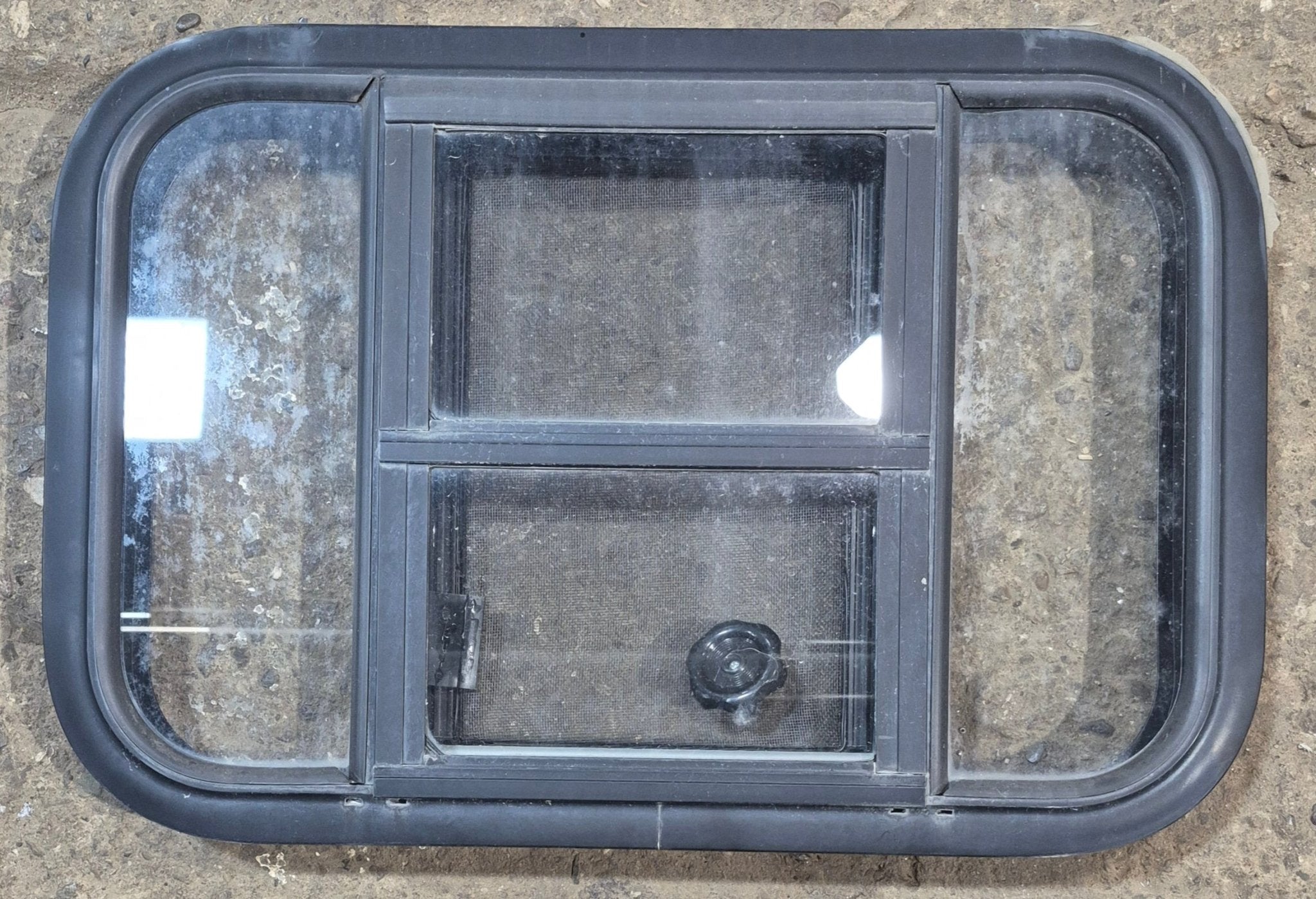 Used Black Radius Opening Window : 23 1/2" W x 15 1/2" H x 1 7/8" - Young Farts RV Parts