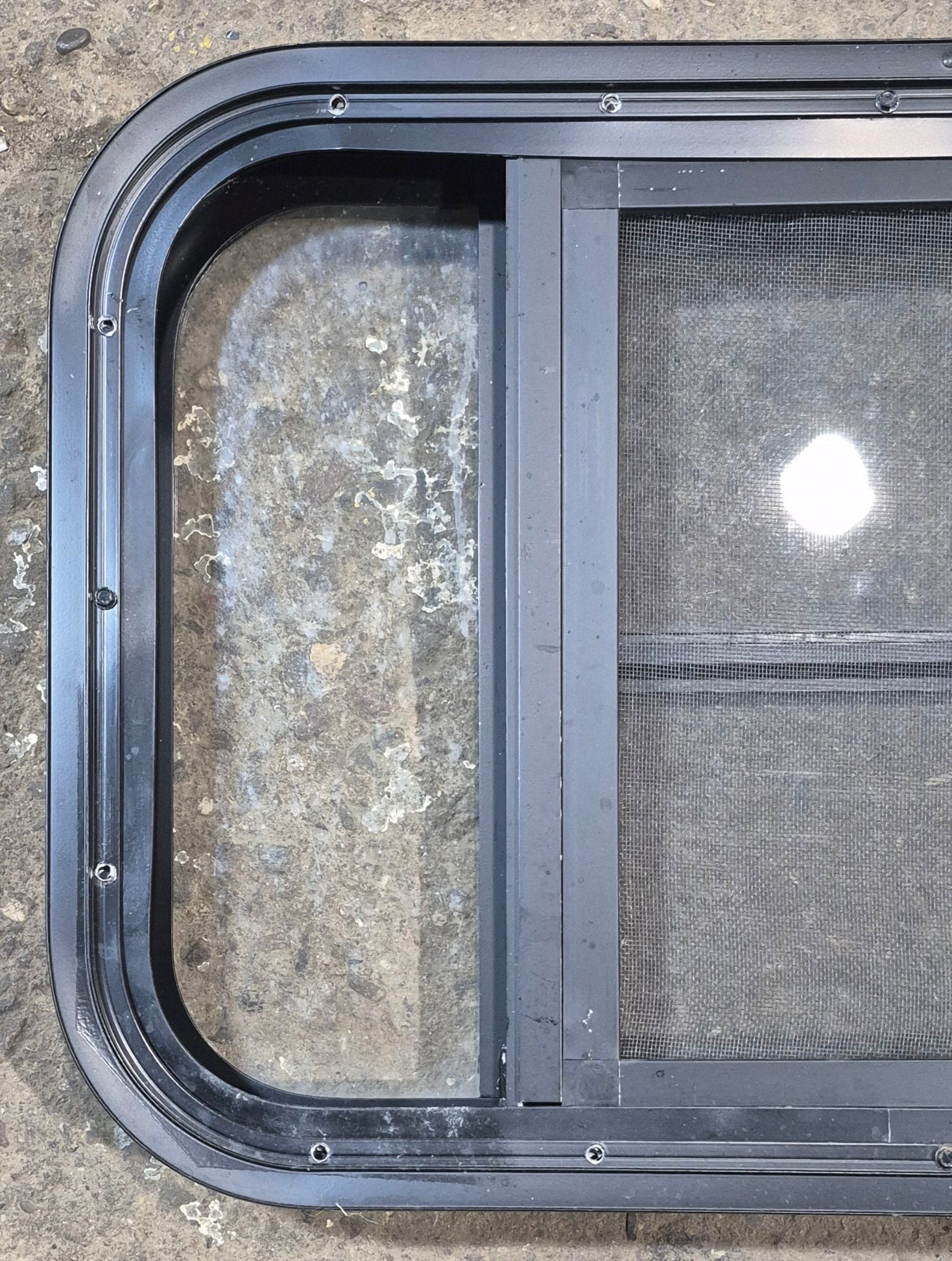 Used Black Radius Opening Window : 23 1/2" W x 15 1/2" H x 1 7/8" - Young Farts RV Parts