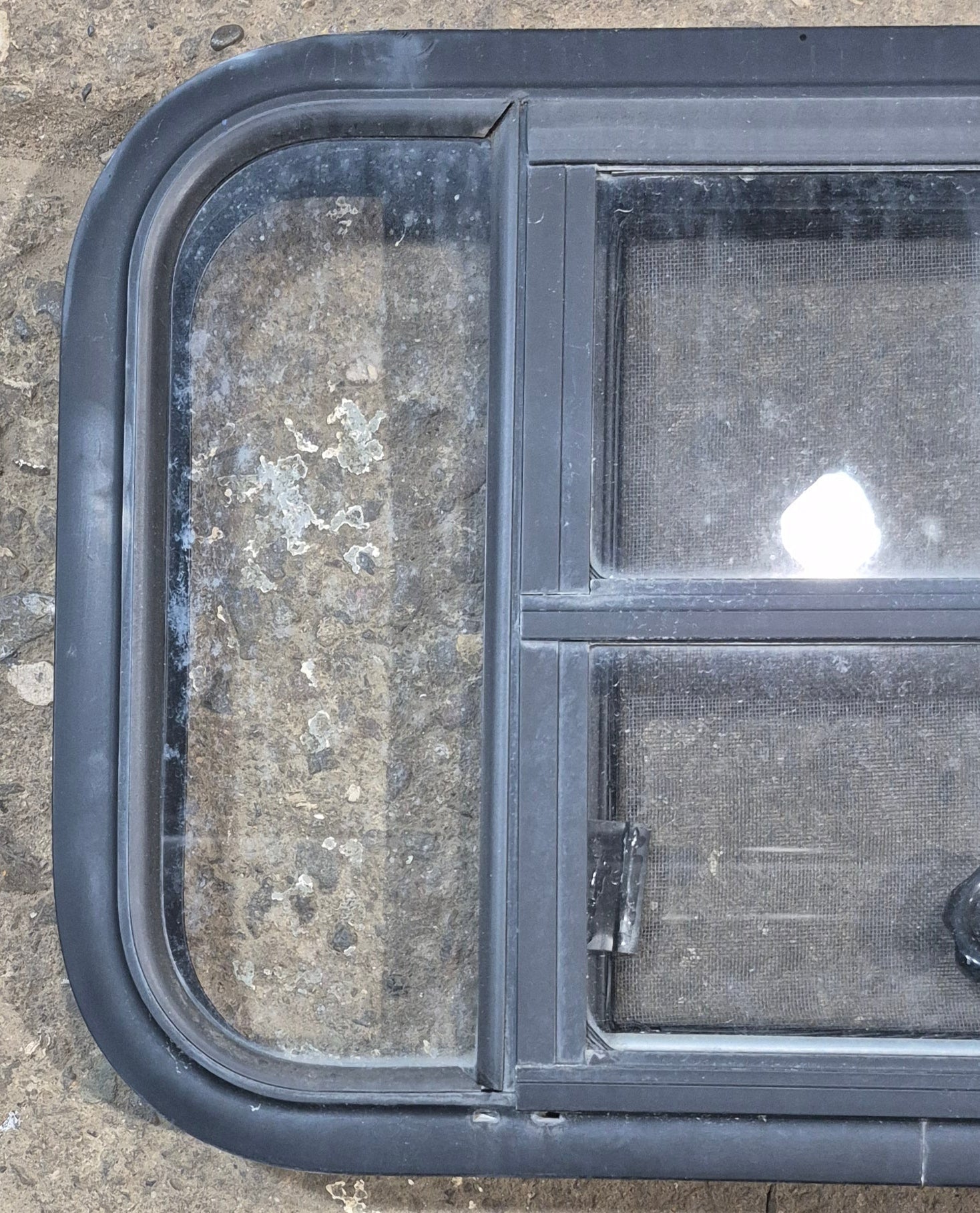 Used Black Radius Opening Window : 23 1/2" W x 15 1/2" H x 1 7/8" - Young Farts RV Parts
