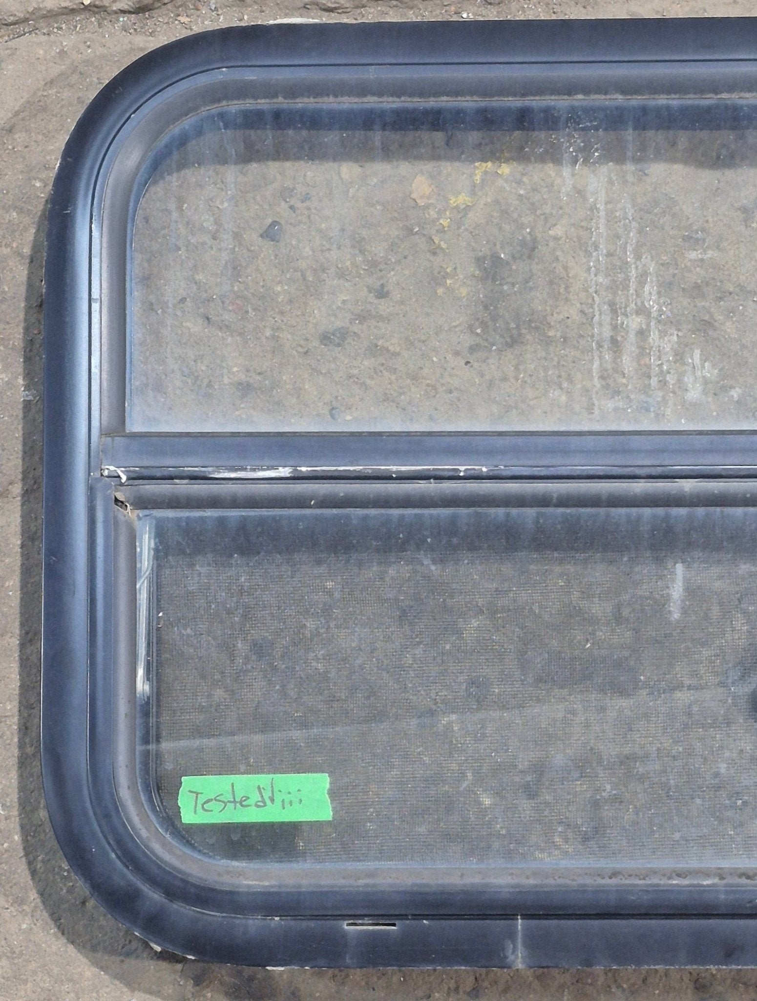 Used Black Radius Opening Window : 23 1/2" W x 17 1/4" H x 1 7/8" D - Young Farts RV Parts
