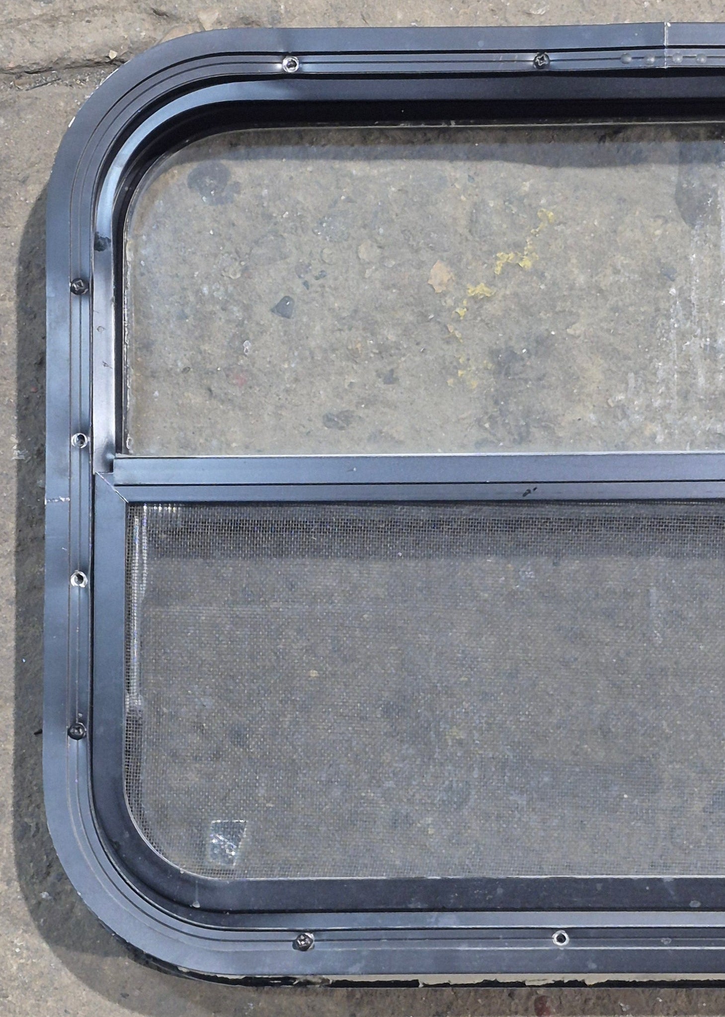 Used Black Radius Opening Window : 23 1/2" W x 17 1/4" H x 1 7/8" D - Young Farts RV Parts