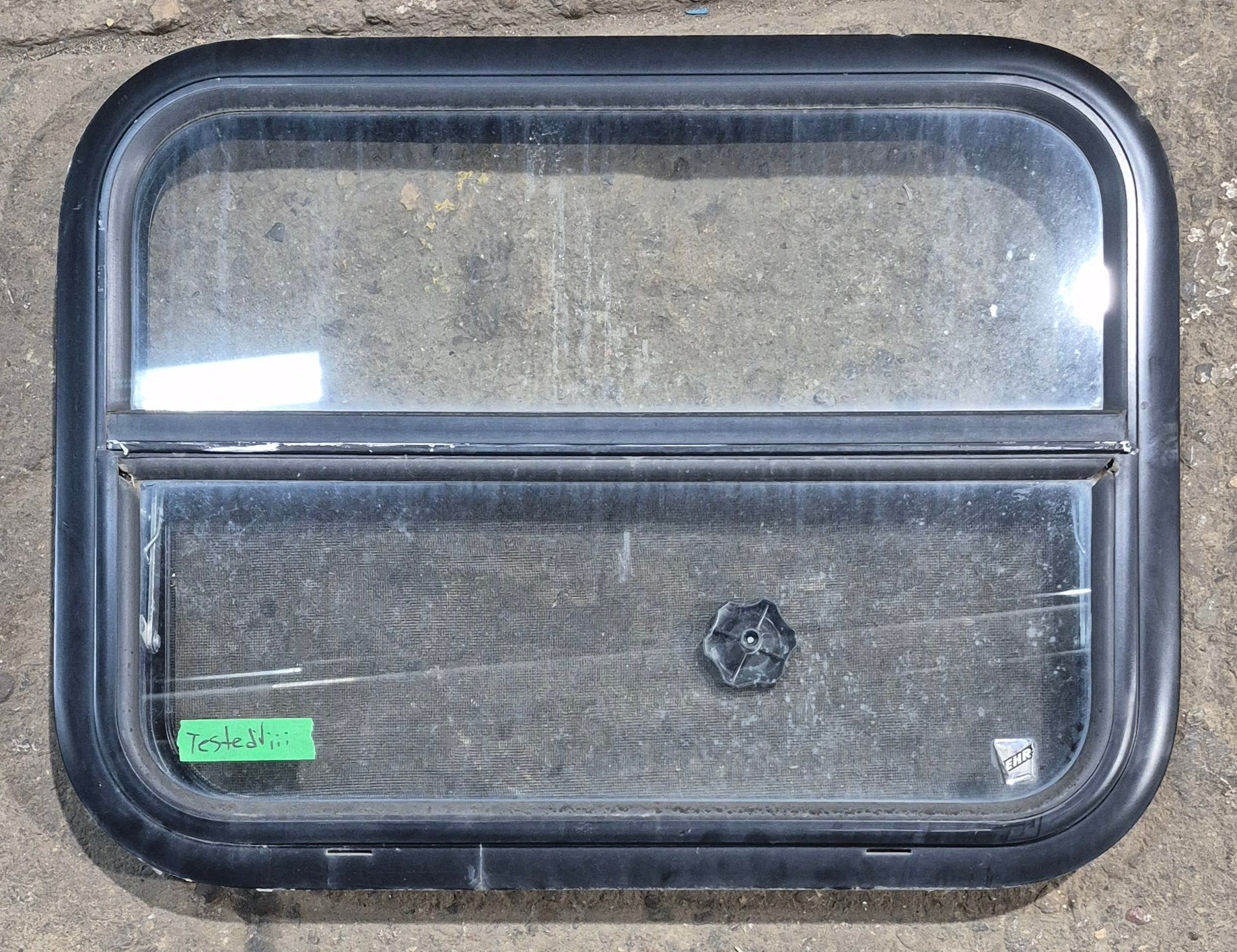 Used Black Radius Opening Window : 23 1/2" W x 17 1/4" H x 1 7/8" D - Young Farts RV Parts