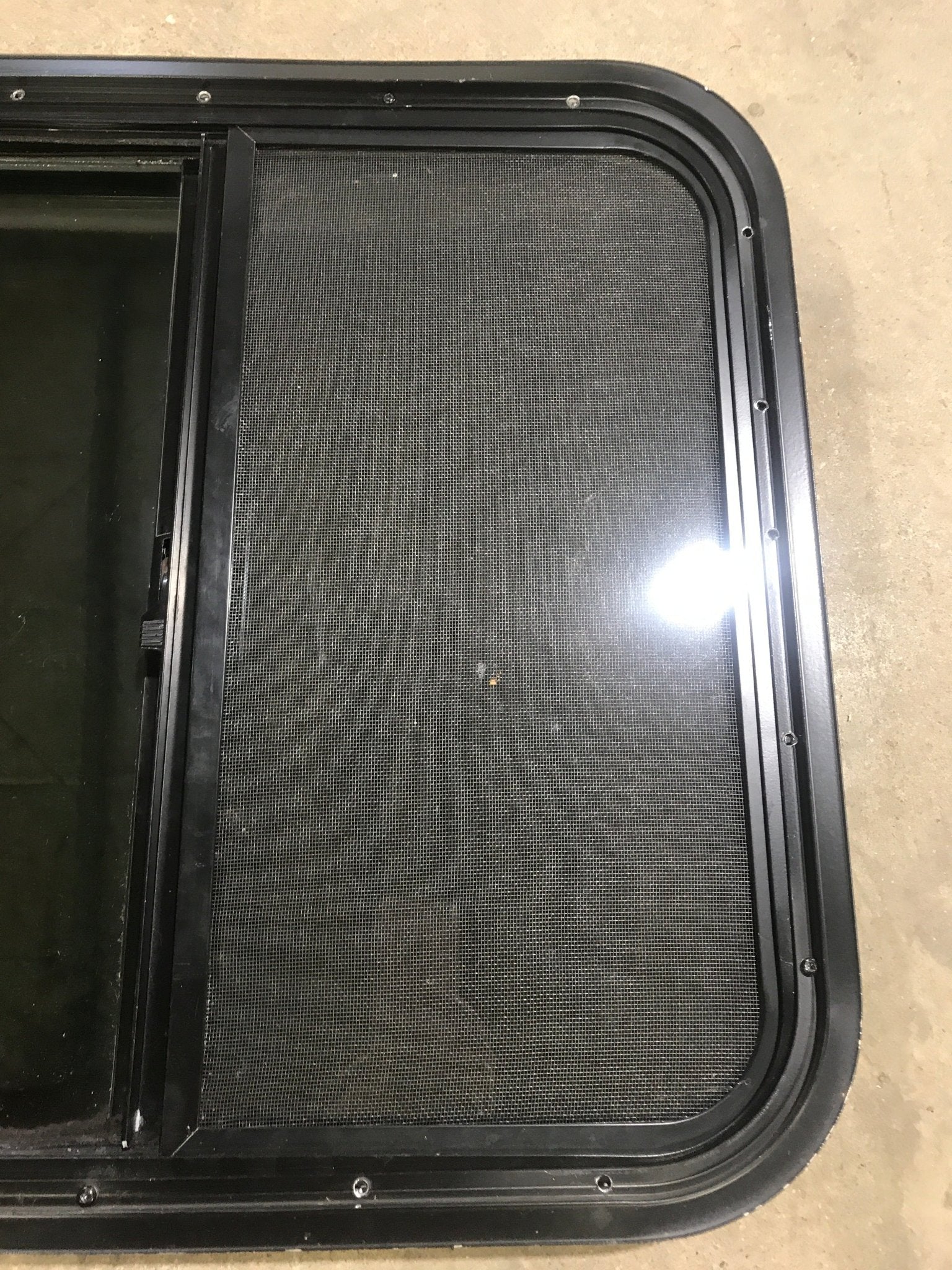 Used Black Radius Opening Window : 23 1/2" W x 21 1/2" H x 1 7/8" D - Young Farts RV Parts