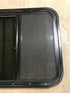 Used Black Radius Opening Window : 23 1/2" W x 21 1/2" H x 1 7/8" D - Young Farts RV Parts