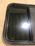 Used Black Radius Opening Window : 23 1/2" W x 21 1/2" H x 1 7/8" D - Young Farts RV Parts