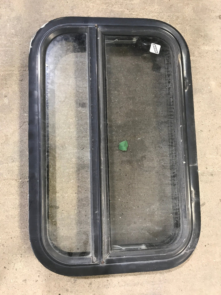 Used Black Radius Opening Window : 23 1/4" W X 14 1/2" H X 2" D - Young Farts RV Parts