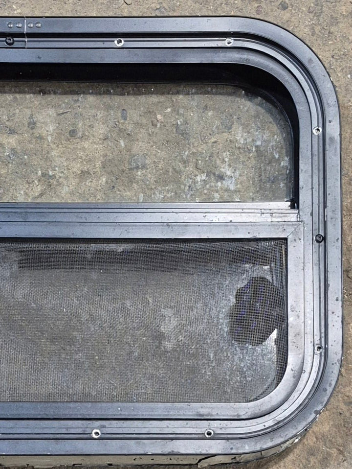 Used Black Radius Opening Window : 23 1/4" W x 14 1/4" H x 1 7/8" - Young Farts RV Parts