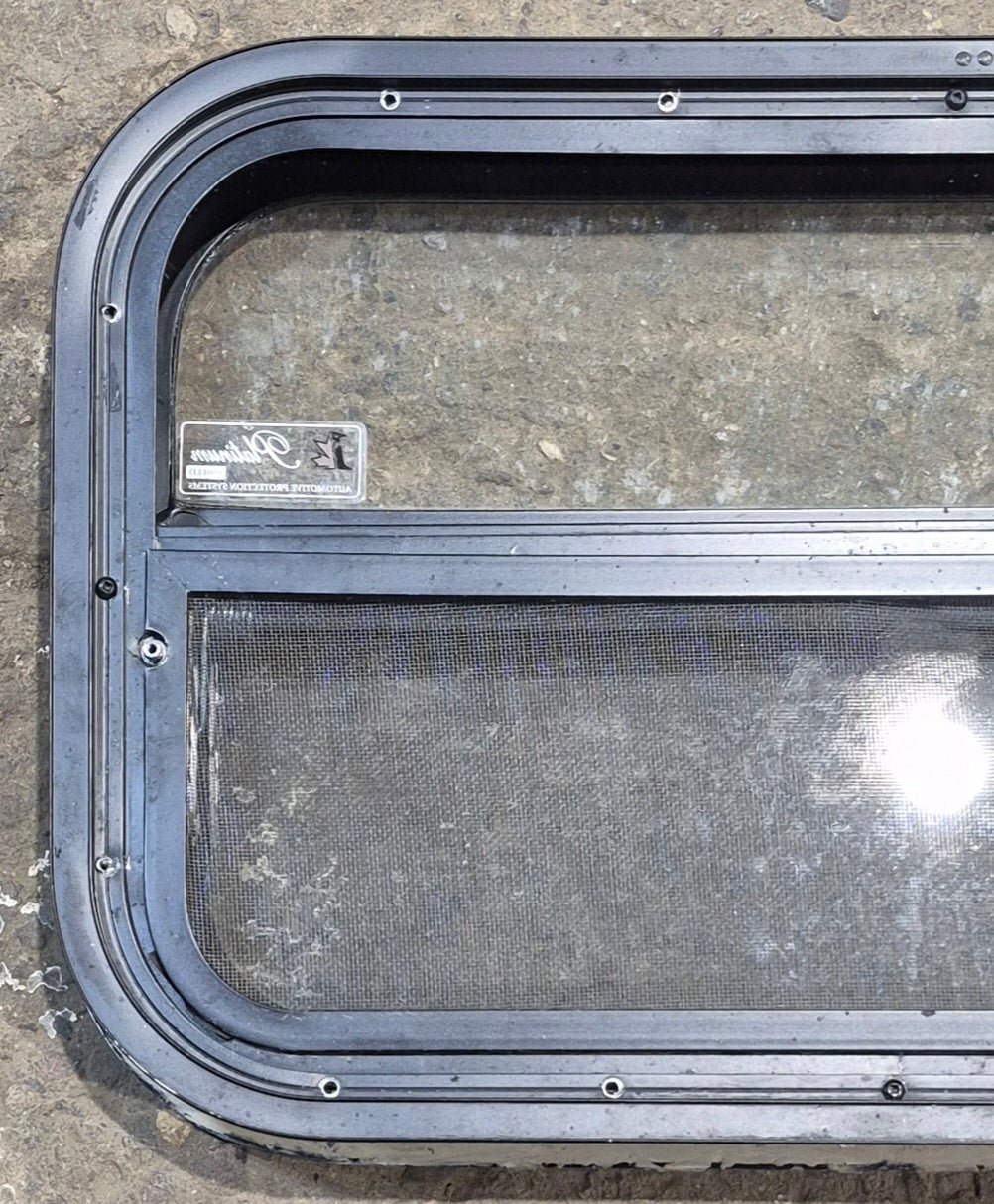 Used Black Radius Opening Window : 23 1/4" W x 14 1/4" H x 1 7/8" - Young Farts RV Parts