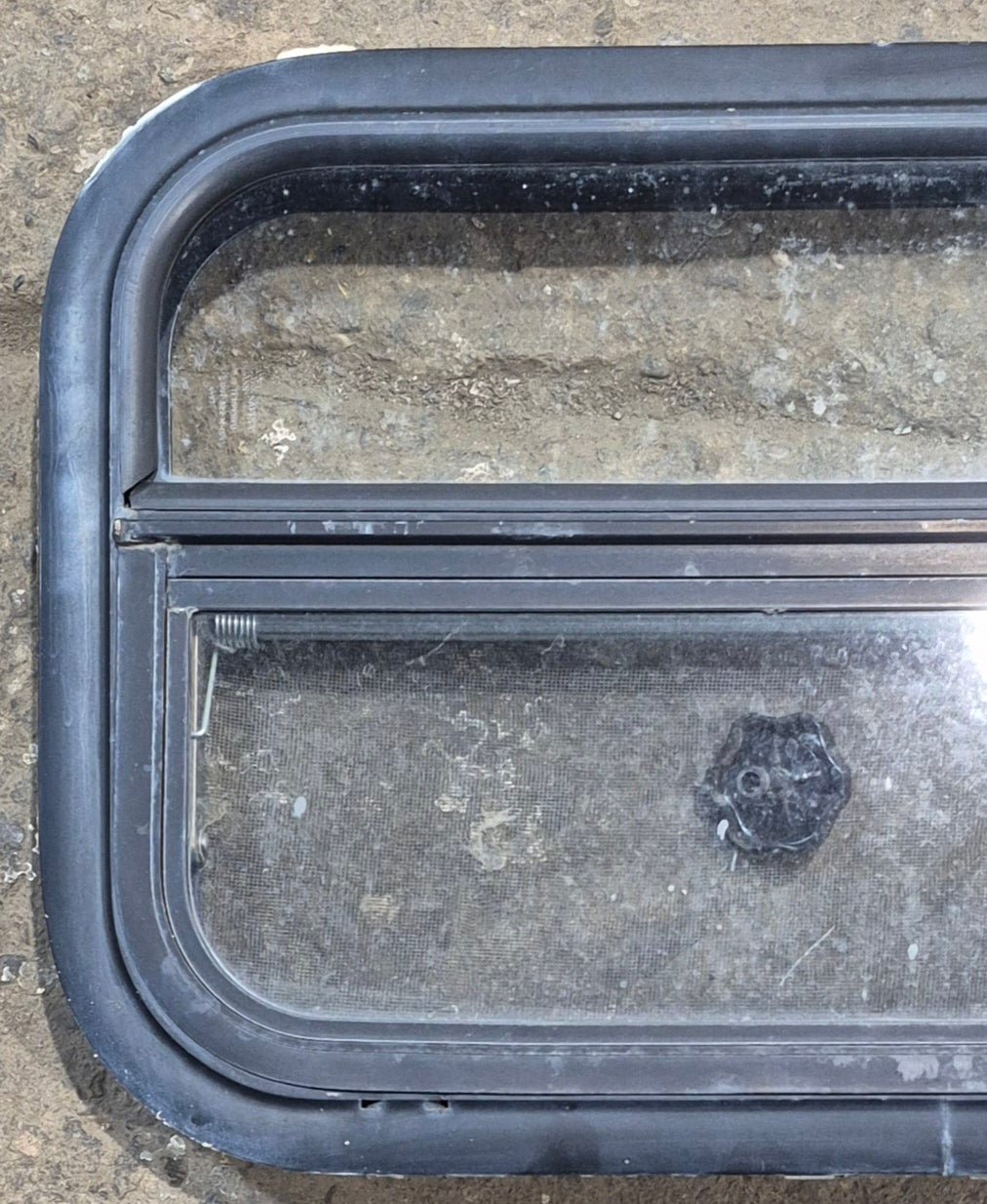 Used Black Radius Opening Window : 23 1/4" W x 14 1/4" H x 1 7/8" - Young Farts RV Parts