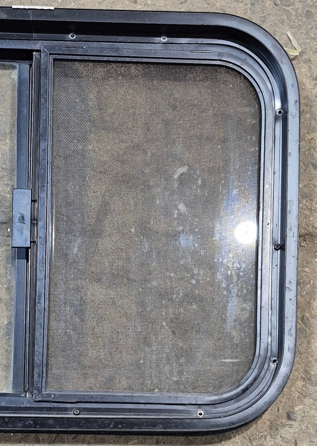 Used Black Radius Opening Window : 23 1/4" W x 17 1/4" H x 1 3/4" - Young Farts RV Parts