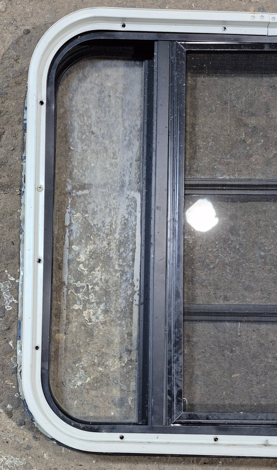 Used Black Radius Opening Window : 23 1/4" W x 21 3/4" H x 1 7/8" - Young Farts RV Parts