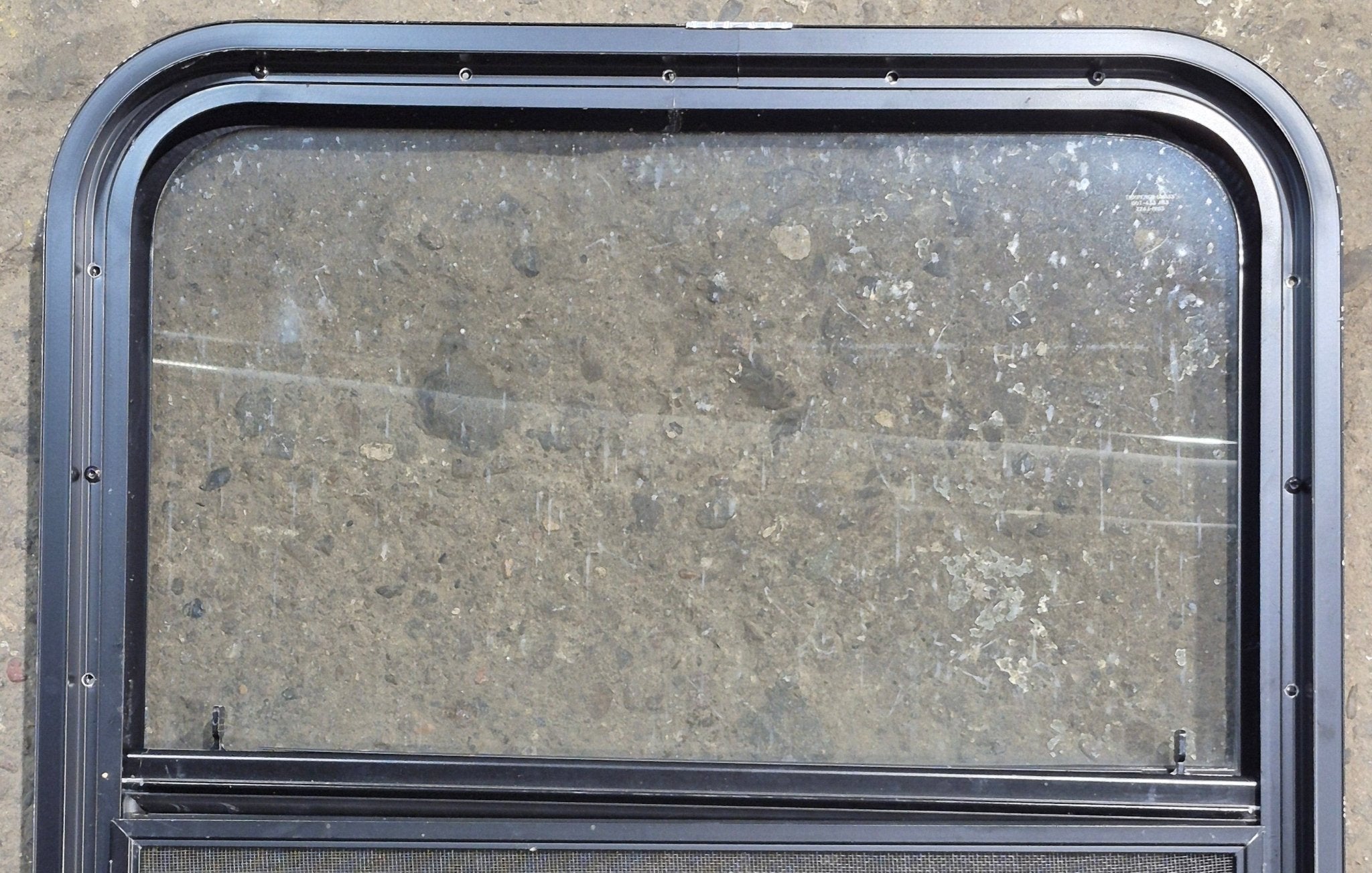Used Black Radius Opening Window : 23 1/4" W x 28 1/4" H x 1 3/4" D - Young Farts RV Parts