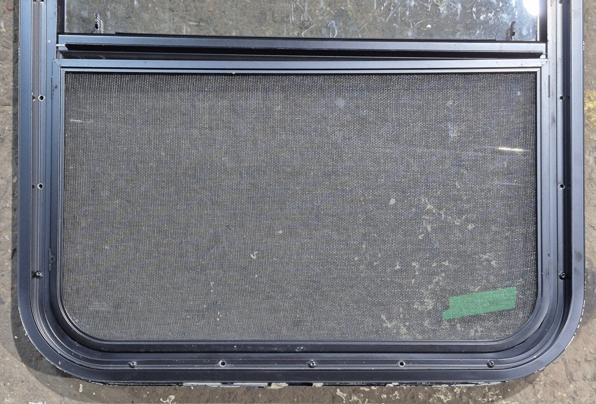 Used Black Radius Opening Window : 23 1/4" W x 28 1/4" H x 1 3/4" D - Young Farts RV Parts