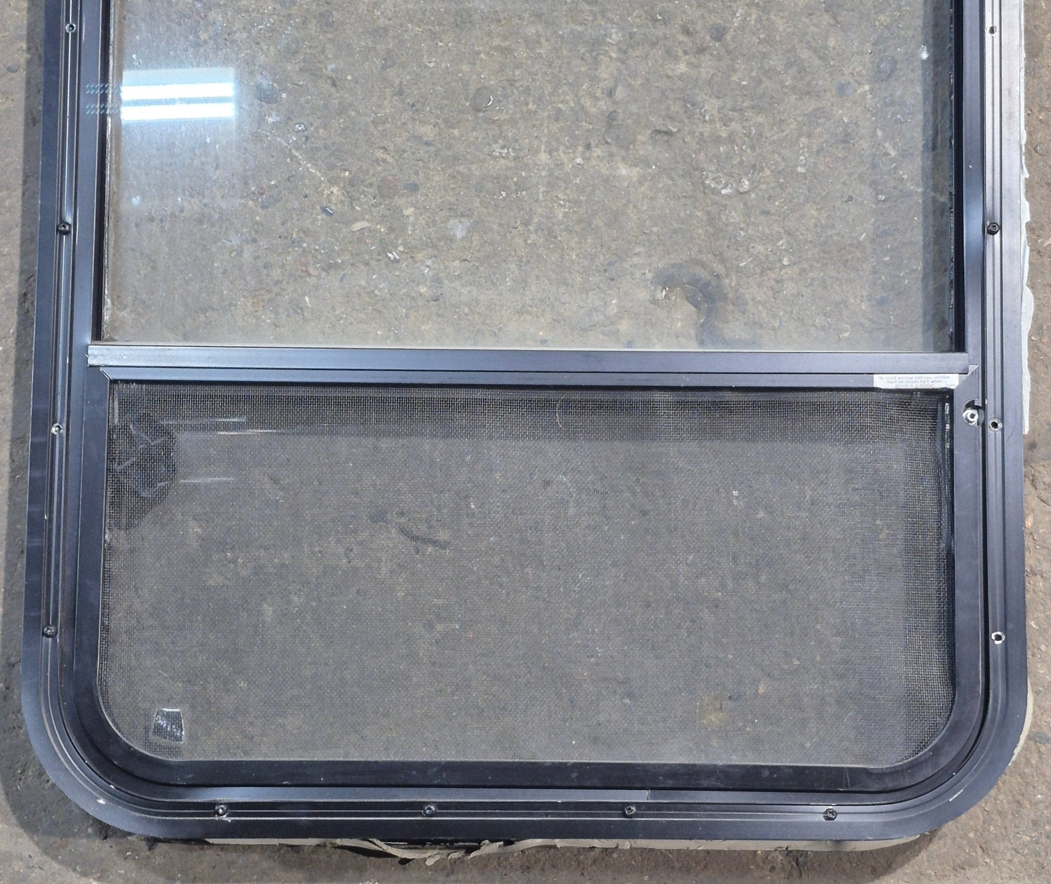 Used Black Radius Opening Window : 23 1/4" W x 34 1/2" H x 1 3/4" D - Young Farts RV Parts
