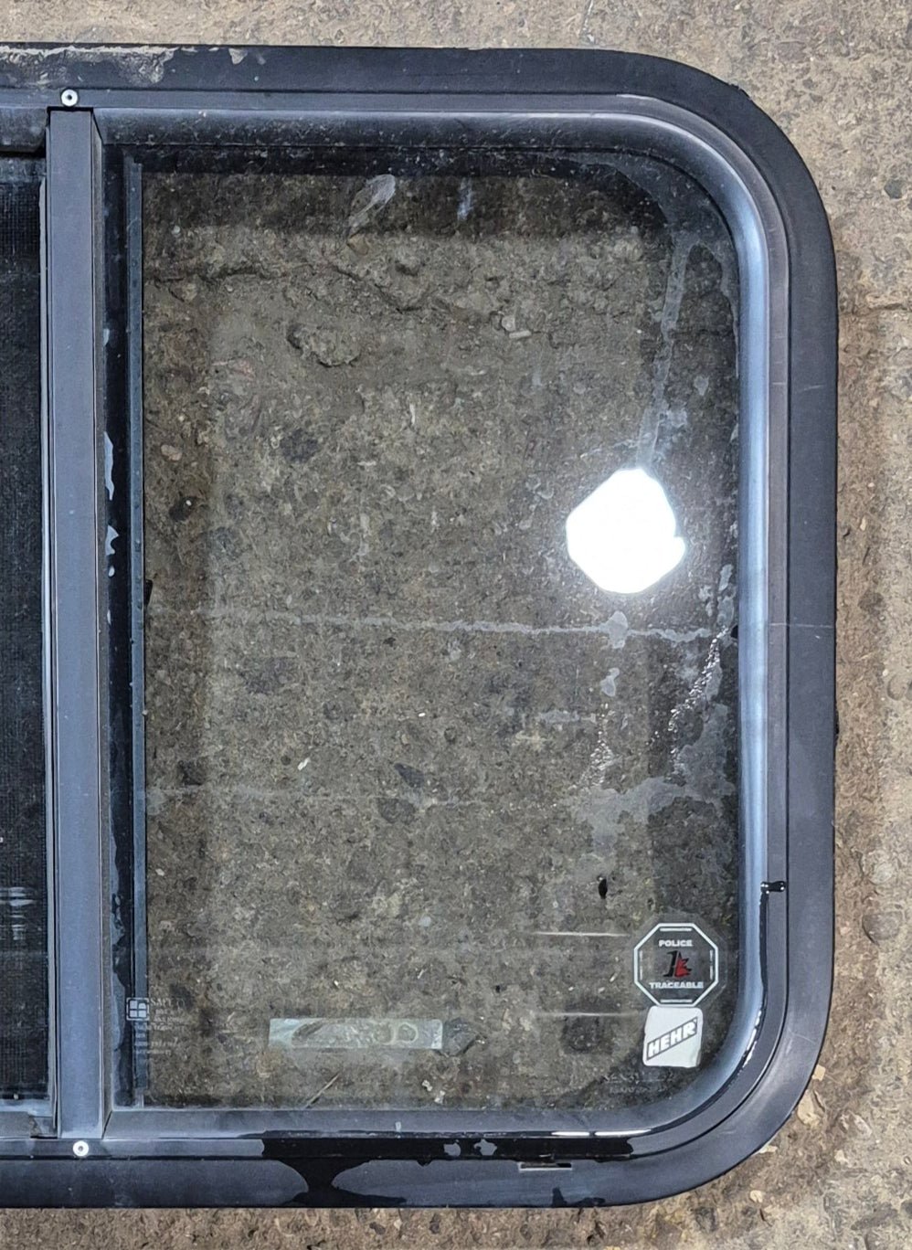 Used Black Radius Opening Window : 23 3/4" W x 17 3/4" H x 1 7/8" - Young Farts RV Parts