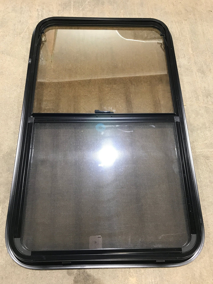 Used Black Radius Opening Window : 23 3/4" W x 39 3/4" H x 1 1/2" D - Young Farts RV Parts