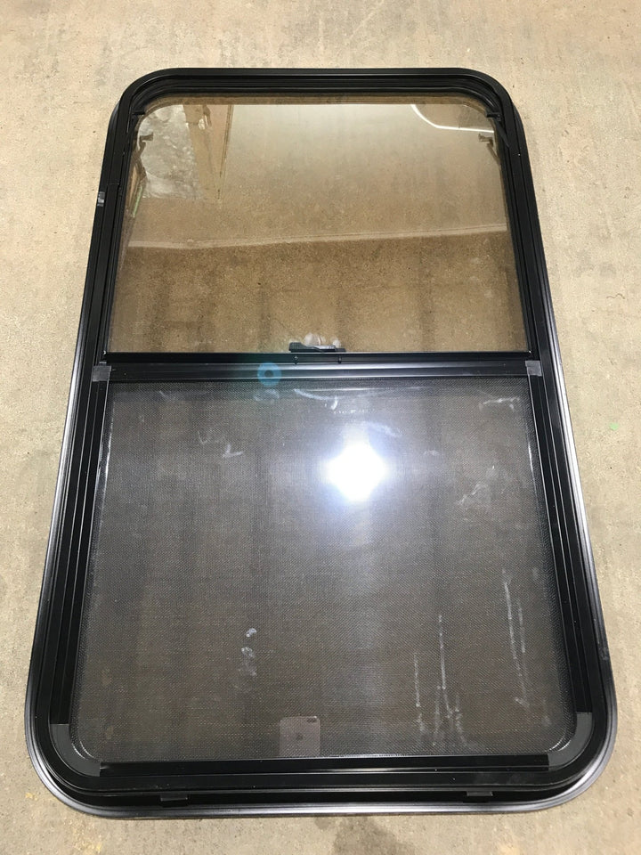 Used Black Radius Opening Window : 23 3/4" W x 39 3/4" H x 1 1/2" D - Young Farts RV Parts