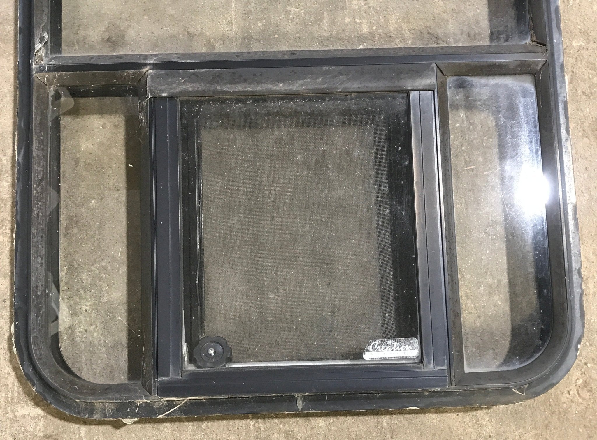 Used Black Radius Opening Window : 23" W x 47 1/2" H x 1 7/8" D - Young Farts RV Parts