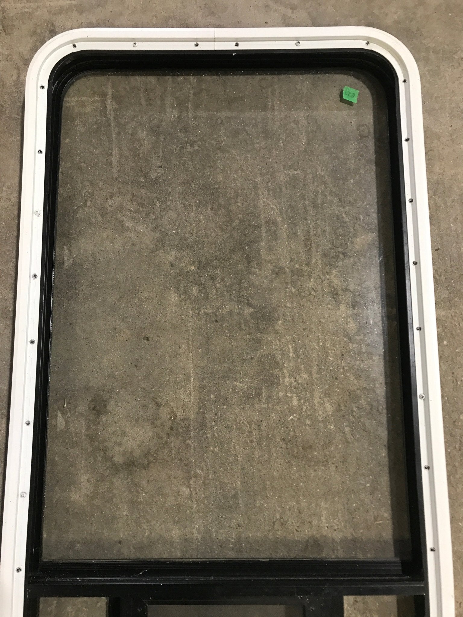 Used Black Radius Opening Window : 23" W x 47 1/2" H x 1 7/8" D - Young Farts RV Parts