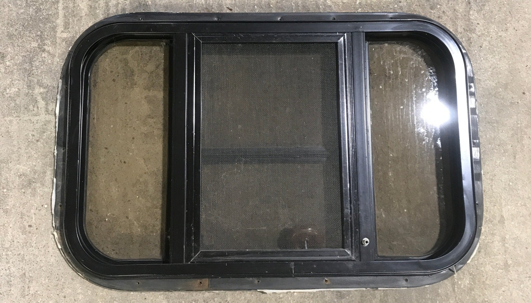 Used Black Radius Opening Window : 24 1/2" W x 16" H x 1 1/2" - Young Farts RV Parts