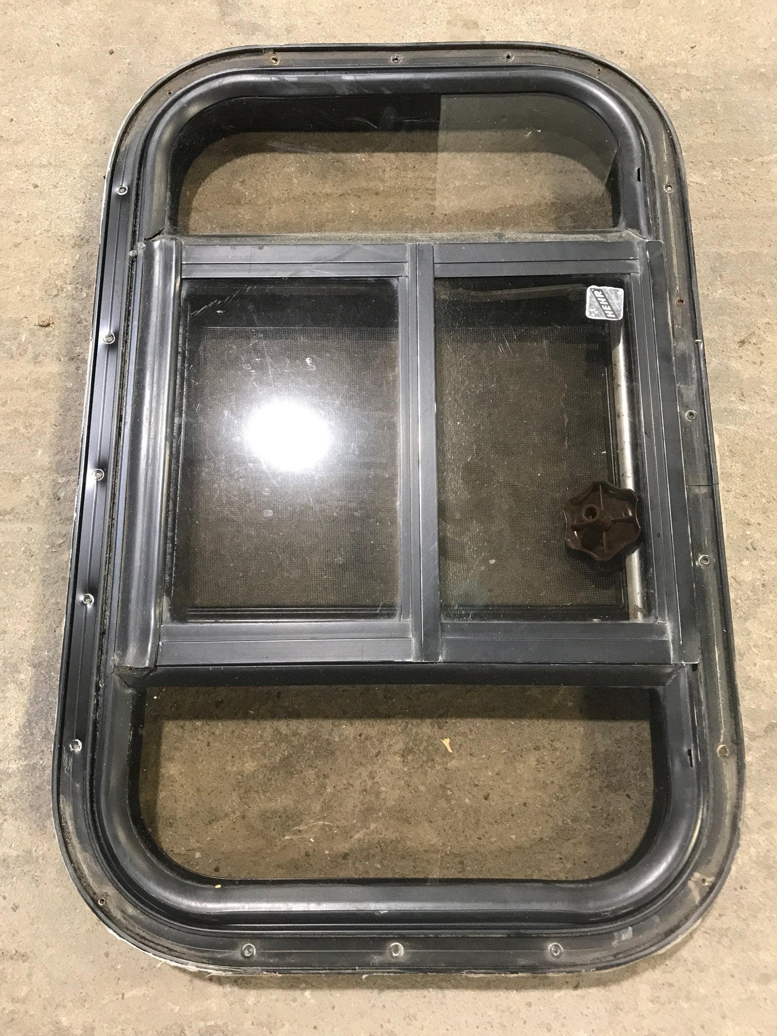 Used Black Radius Opening Window : 24 1/2" W x 16" H x 1 1/2" - Young Farts RV Parts