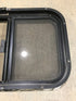 Used Black Radius Opening Window : 24 1/2" W x 19 1/4" H x 1 1/4" - Young Farts RV Parts