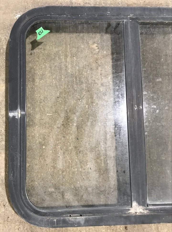 Used Black Radius Opening Window : 24 1/2" W x 21 1/2" H x 1 7/8" D - Young Farts RV Parts