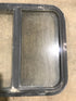 Used Black Radius Opening Window : 24 1/2" W x 21 1/2" H x 1 7/8" D - Young Farts RV Parts