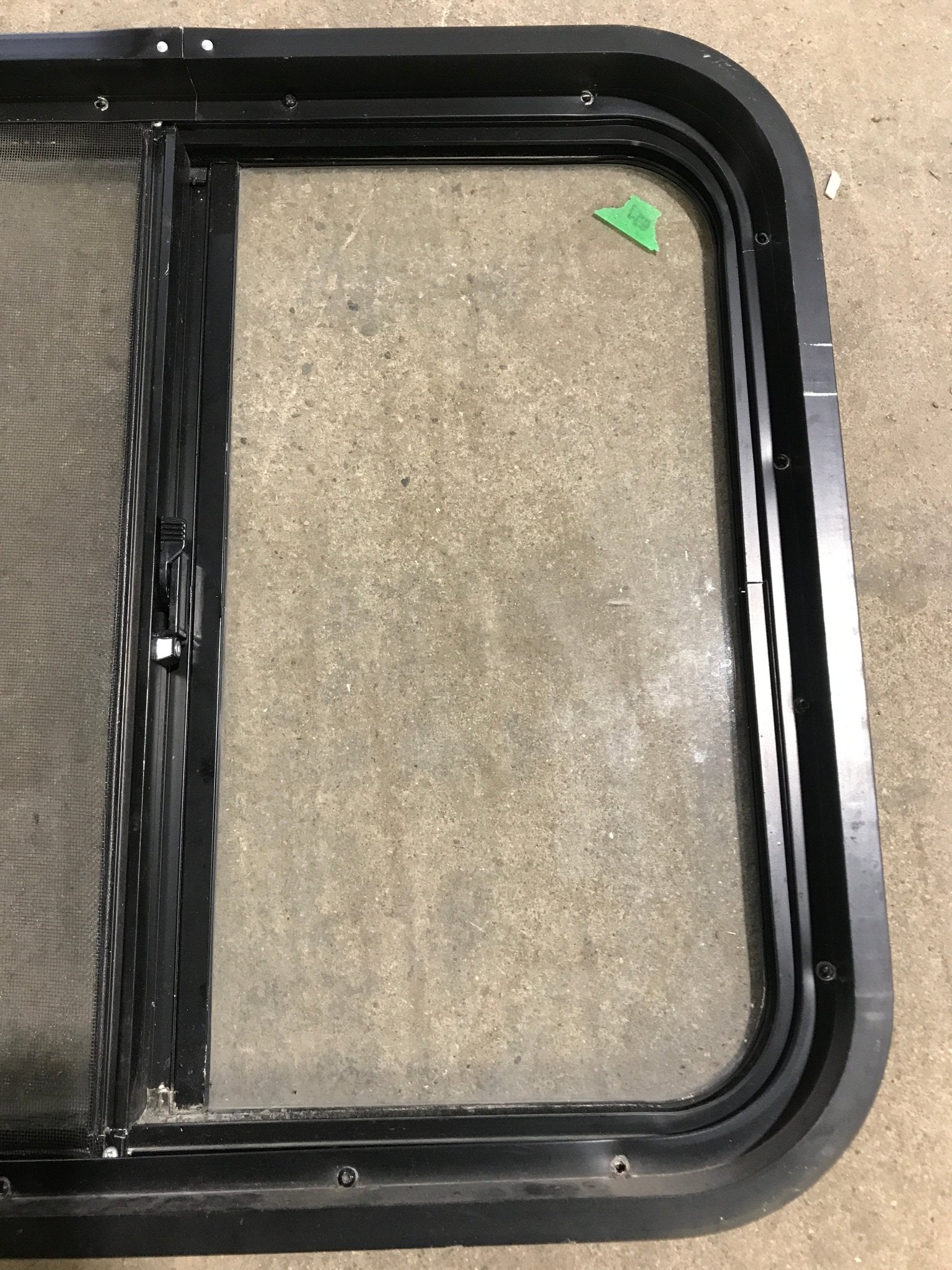 Used Black Radius Opening Window : 24 1/2" W x 21 1/2" H x 1 7/8" D - Young Farts RV Parts