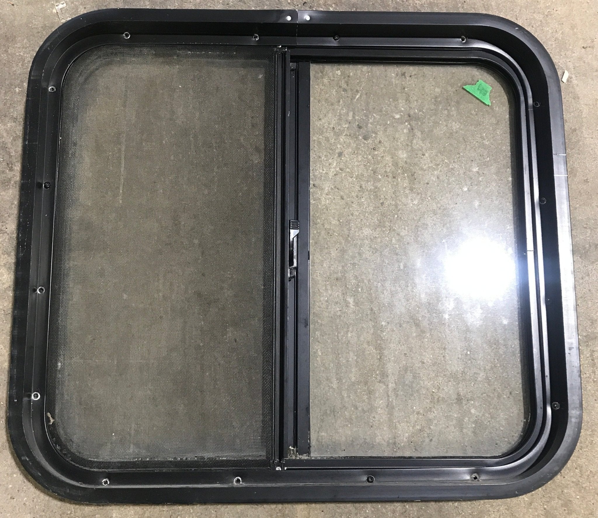 Used Black Radius Opening Window : 24 1/2" W x 21 1/2" H x 1 7/8" D - Young Farts RV Parts