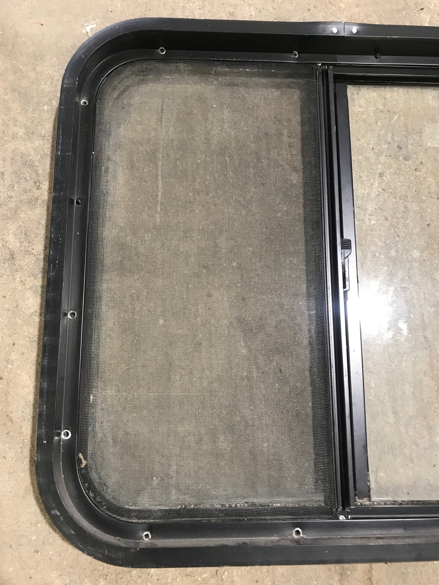 Used Black Radius Opening Window : 24 1/2" W x 21 1/2" H x 1 7/8" D - Young Farts RV Parts
