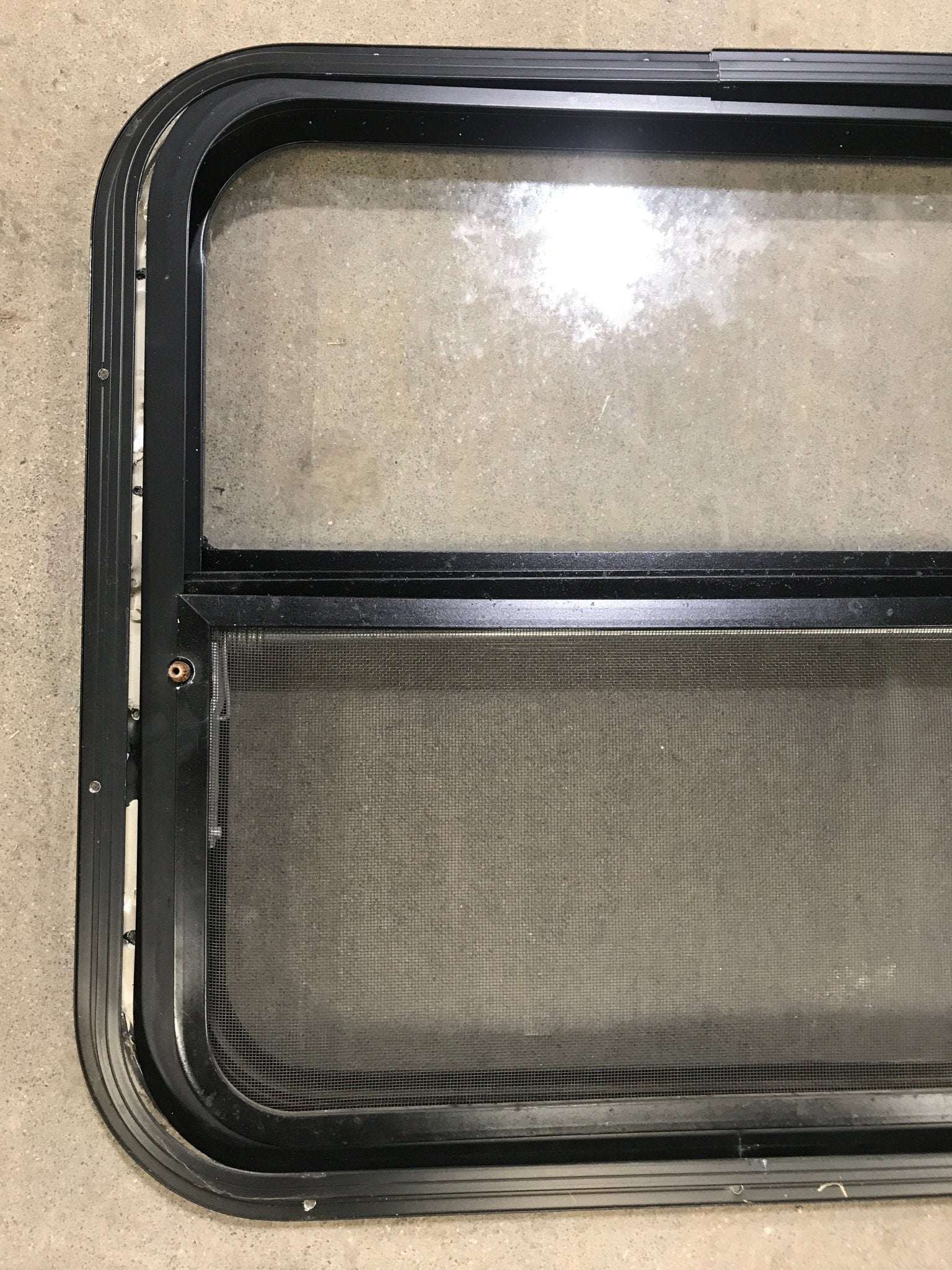 Used Black Radius Opening Window : 24 1/2" W x 22 1/2" H x 2" D - Young Farts RV Parts