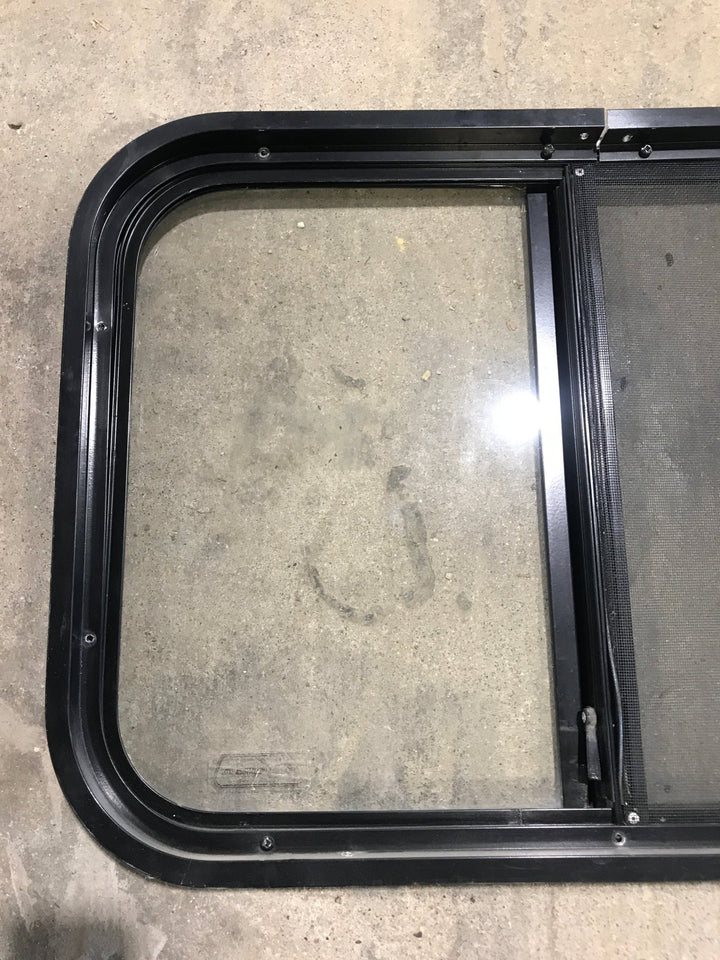 Used Black Radius Opening Window : 24 1/4" W x 17 3/4" H x 1 1/4" - Young Farts RV Parts