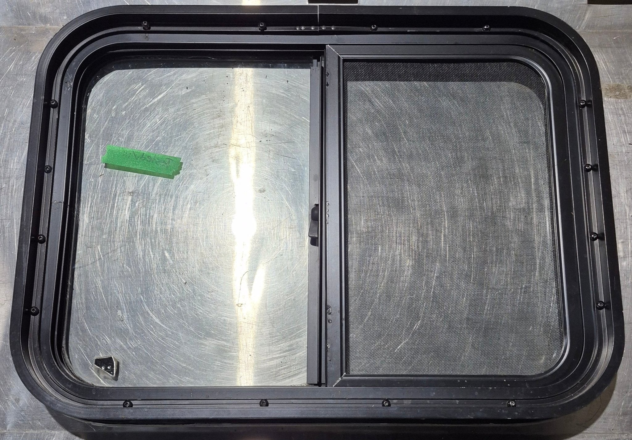 Used Black Radius Opening Window : 24 1/4" W x 17 3/4" H x 1 3/4" - Young Farts RV Parts