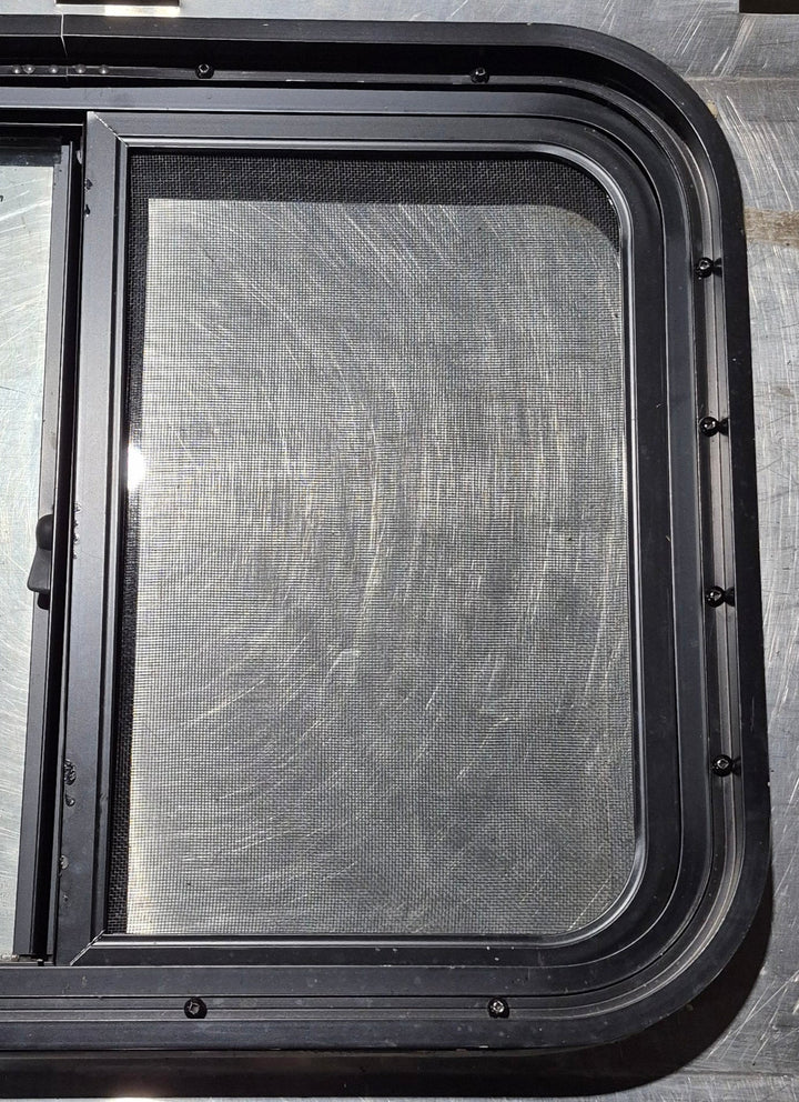 Used Black Radius Opening Window : 24 1/4" W x 17 3/4" H x 1 3/4" - Young Farts RV Parts