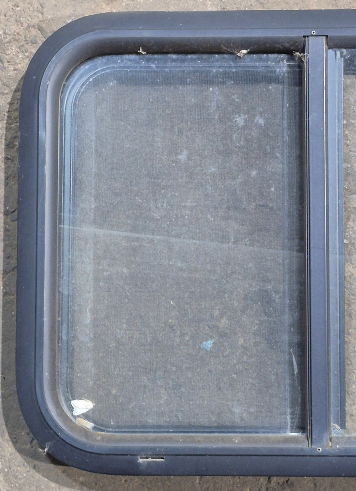 Used Black Radius Opening Window : 24 1/4" W x 17 3/4" H x 1 5/8" D - Young Farts RV Parts