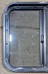 Used Black Radius Opening Window : 24 1/4" W x 21 3/4" H x 1 7/8" - Young Farts RV Parts