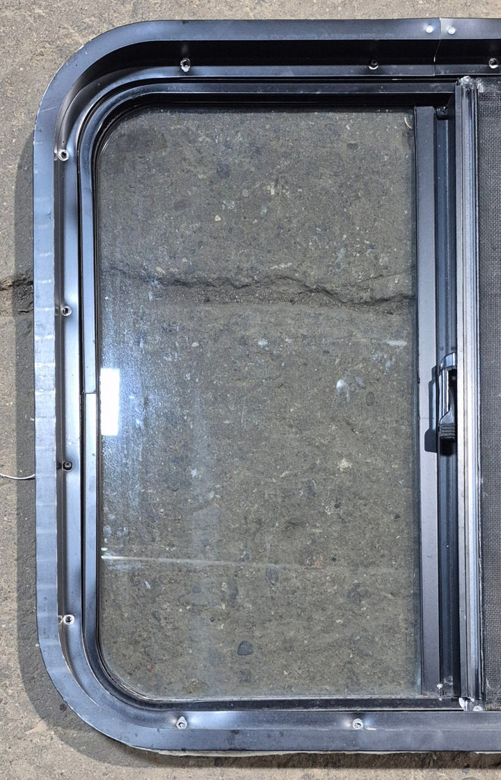 Used Black Radius Opening Window : 24 1/4" W x 21 3/4" H x 1 7/8" - Young Farts RV Parts