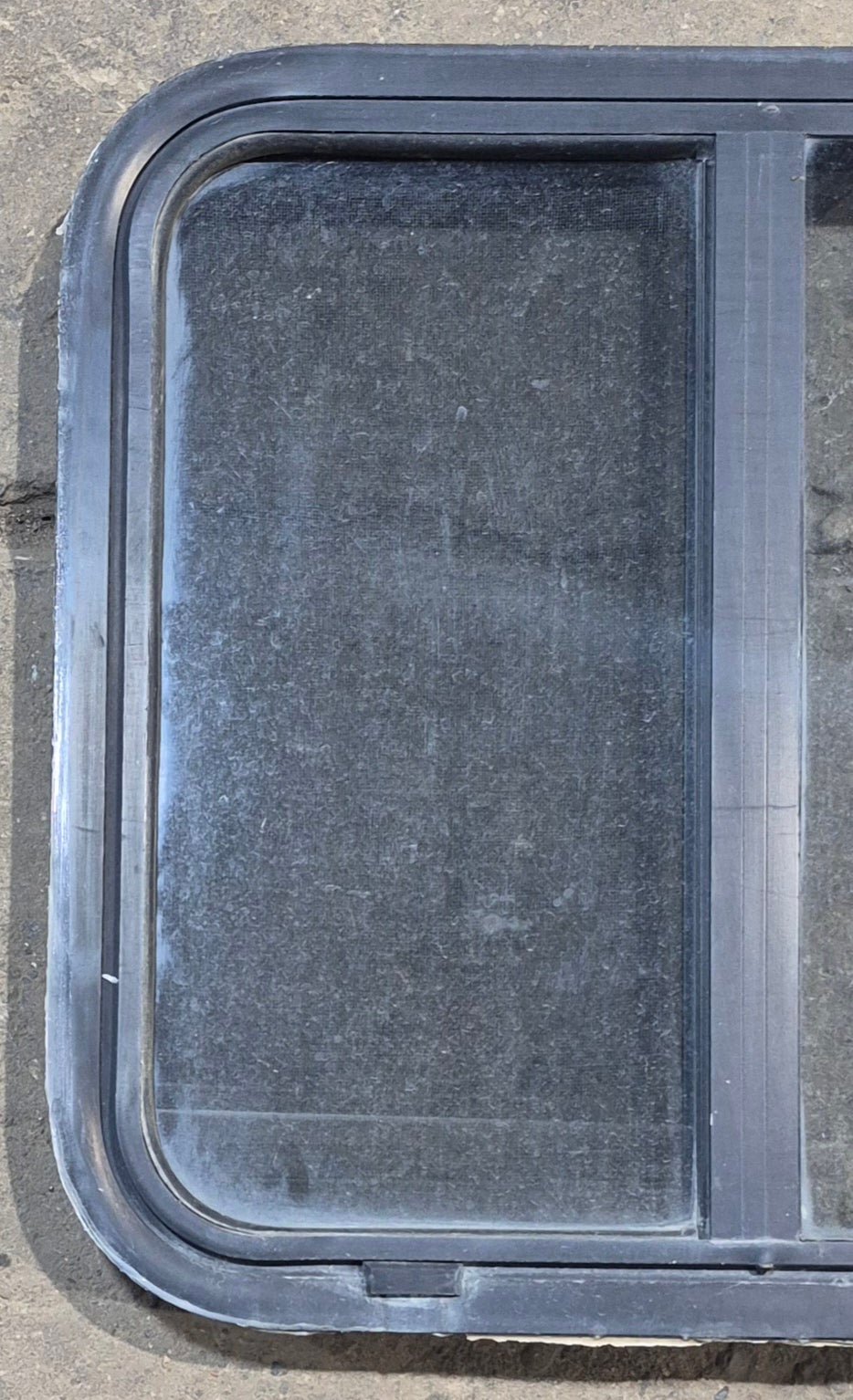 Used Black Radius Opening Window : 24 1/4" W x 21 3/4" H x 1 7/8" - Young Farts RV Parts