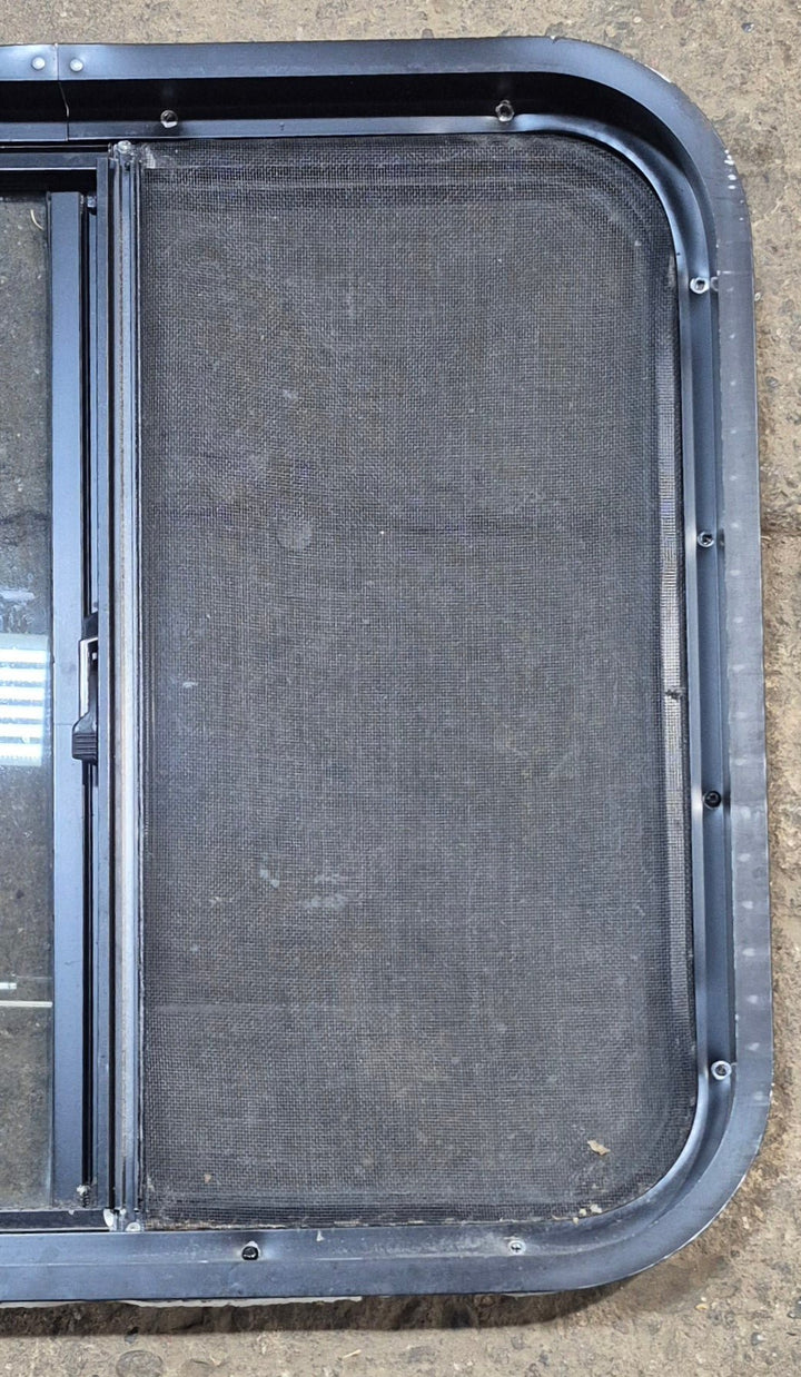Used Black Radius Opening Window : 24 1/4" W x 21 3/4" H x 1 7/8" - Young Farts RV Parts