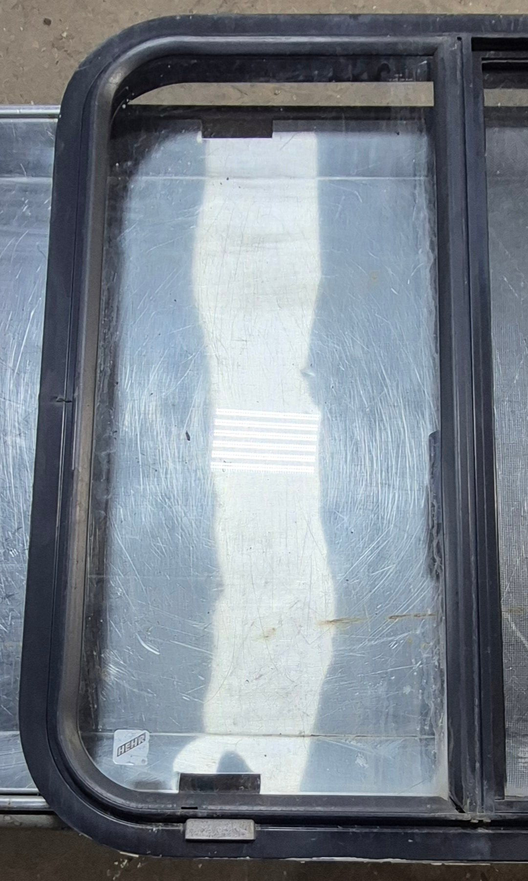 Used Black Radius Opening Window : 24 1/4" W x 25 3/4" H x 1 3/4" - Young Farts RV Parts