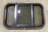 Used Black Radius Opening Window : 24 3/4" W x 15 3/4" H x 1 1/2" D - Young Farts RV Parts