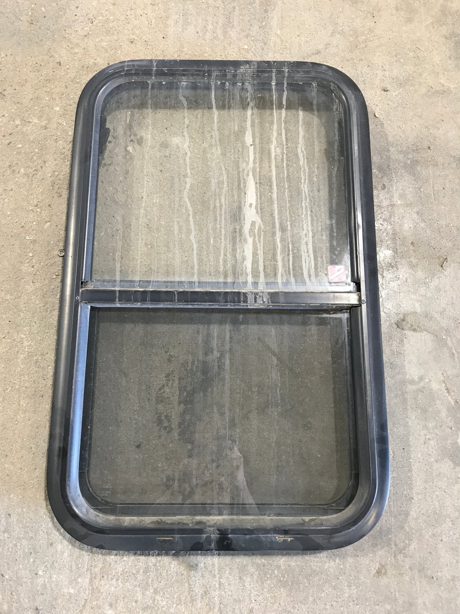 Used Black Radius Opening Window : 28 3/4" W x 17 1/2" H x 2" - Young Farts RV Parts