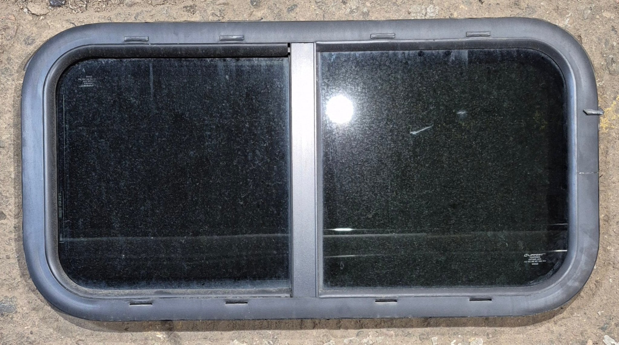 Used Black Radius Opening Window : 29 1/2" W x 14 1/2" H x 1 1/4" - Young Farts RV Parts