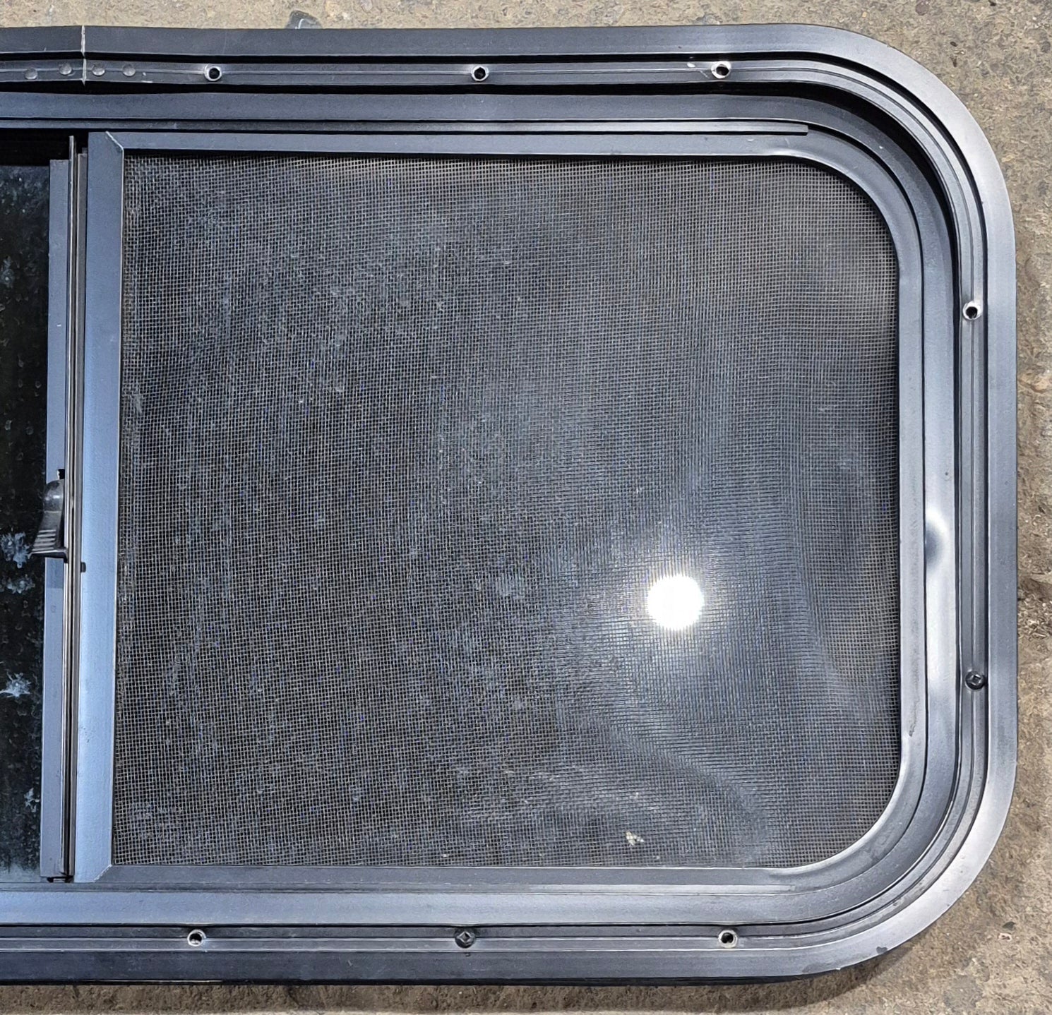 Used Black Radius Opening Window : 29 1/2" W x 14 1/4" H x 1 1/4" - Young Farts RV Parts